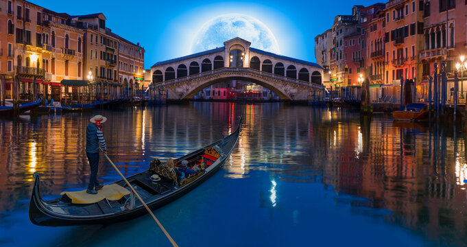 Venice city canals with gondolas, historic buildings and bridges
